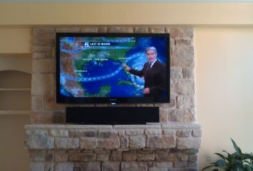 samsung-living-room-tv-installed-on-stone-with-sound-bar-irving-tx